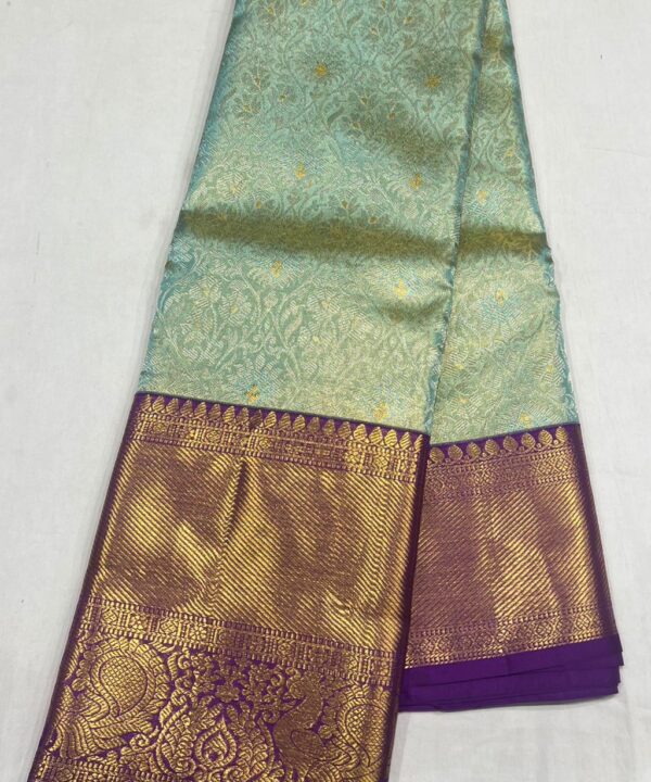 Elegant Pastel Blue Kanchipuram Silk Saree with Rich Purple Zari Border & Golden Motifs