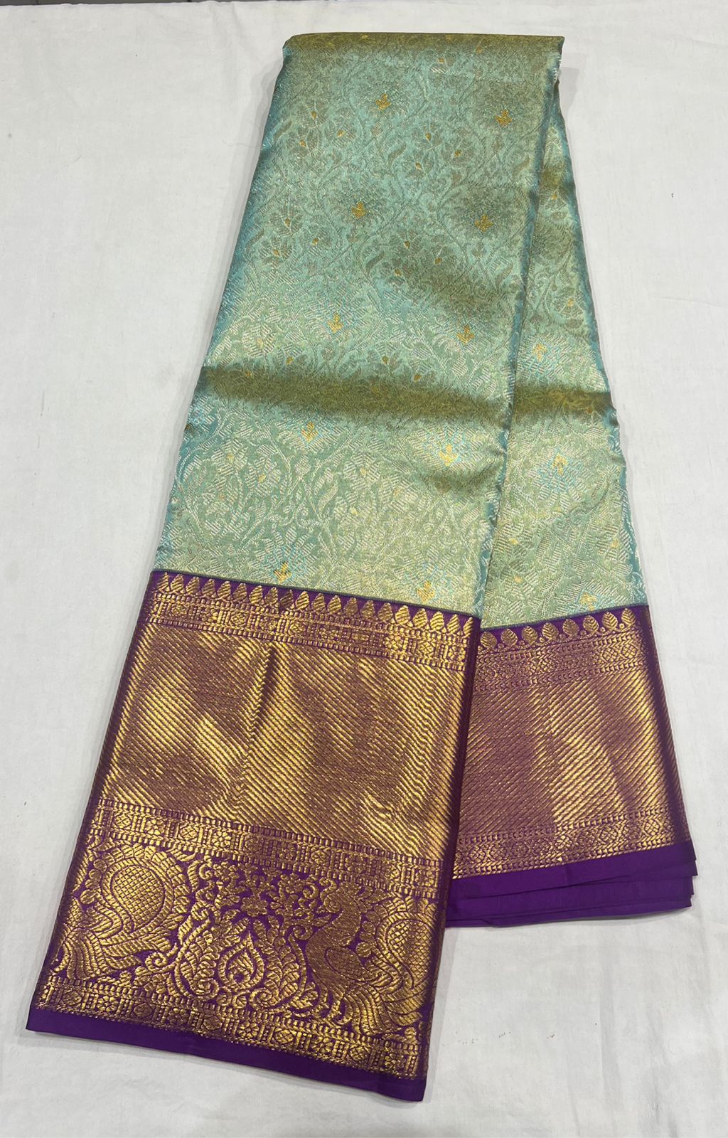 Elegant Pastel Blue Kanchipuram Silk Saree with Rich Purple Zari Border & Golden Motifs